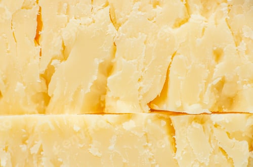 Preview: Aged parmesan cheese texture background close up