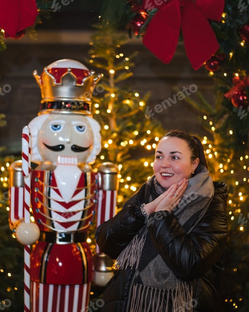 Preview: Happy Woman Beside Nutcracker at Festive Display