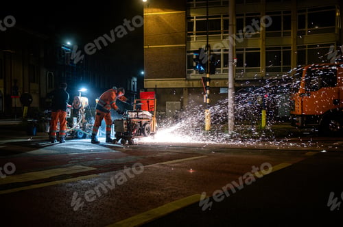 Preview: Road Crew Grinding Tram Tracks with Sparks at Night