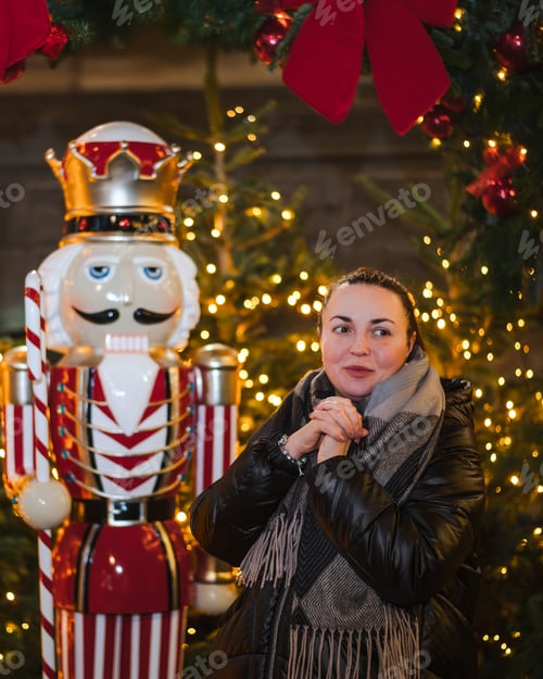 Preview: Woman with Clasped Hands Beside Festive Nutcracker