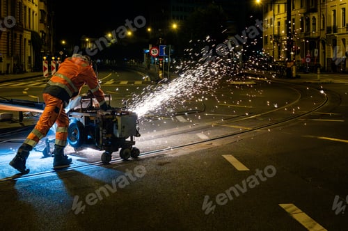 Preview: Railway Worker Grinding Rails with Flying Sparks