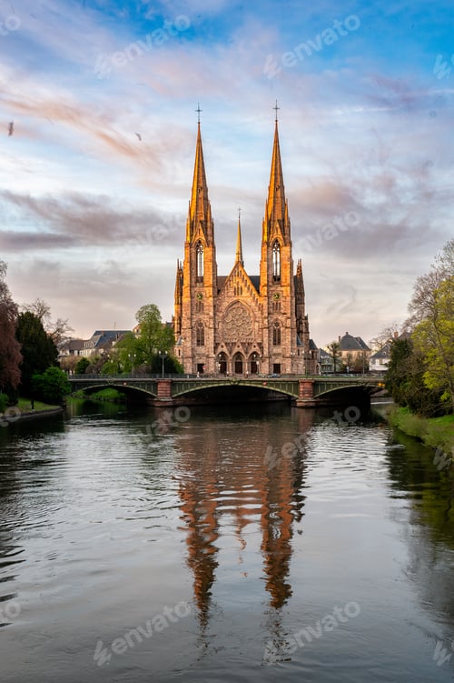 Preview: Cathedral Spires Glowing Above Canal at Dusk Couple Walk