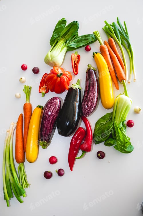 Preview: Bold vertical vegetable display for market with eggplant