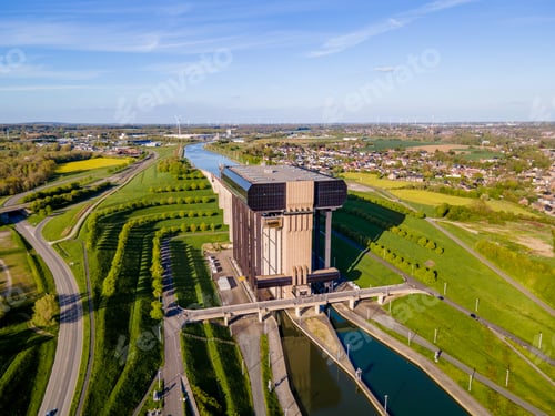Preview: Wide drone landscape of canal cutting through Belgian farmland