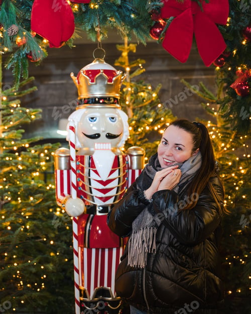 Preview: Smiling Woman Beside Nutcracker at Christmas Display
