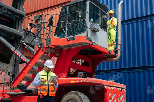 Preview: Logistics workers in safety vests and helmets collaborating at a shipping cargo container yard, with