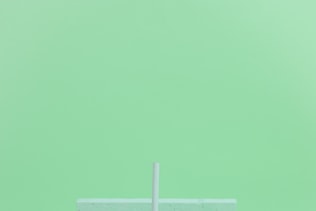 Minimal aesthetic still life monochrome design. Aqua Menthe trends.
Smoothie mug and abstraction