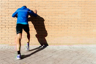 Handsome man running in the city. Fitness, workout, sport, lifestyle concept.