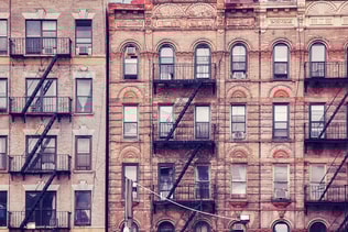 Old buildings with fire escapes in New York City.