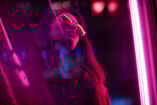 Portrait of young woman with long black hair and red leather jacket