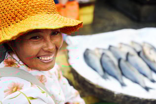 Indigenous Cambodian Woman Selling Fish In A Market