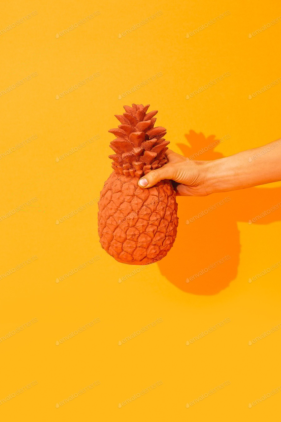 Cover for Hand holding creative pineapple on yellow background. Minimal. Stylish Still life.
