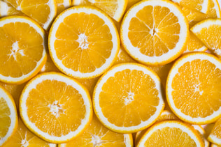 Sliced orange background. Food and drink