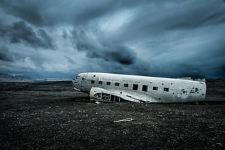 The remains of a crashed plane. Iceland. Side of volcanic beach.
