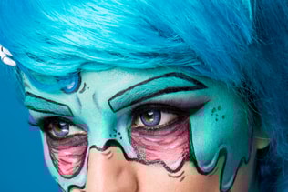 Fashionable zombie girl. Portrait of a pin-up zombie woman. Body-painting project. Halloween make-up