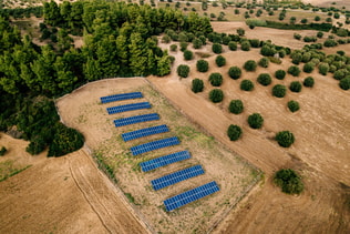 Aerial view of Solar panels farm in a field in the countryside in Greece.