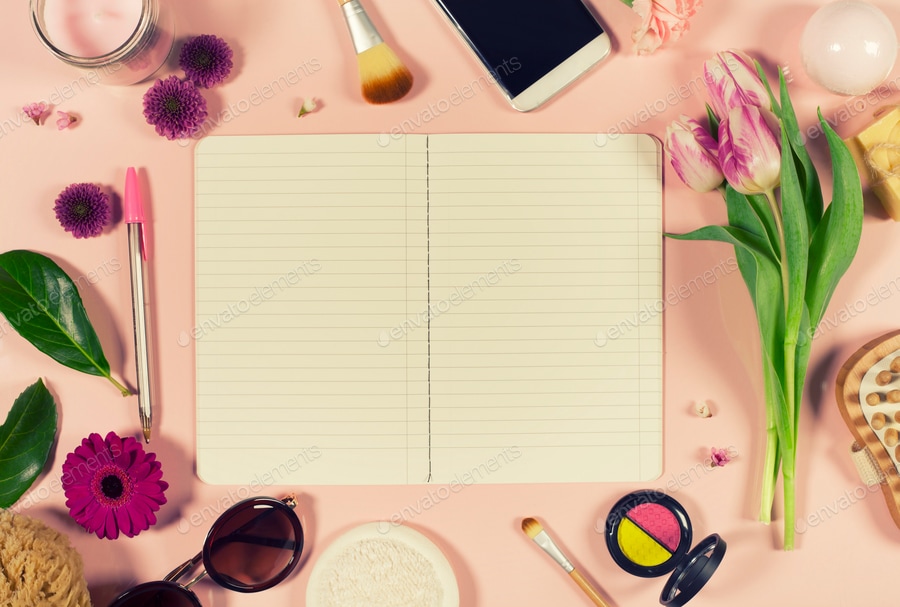 Creative beauty feminine arrangement of flowers and cosmetics